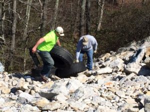Removing Tires at Buzzards Rock. Photo by Andre Weltman.